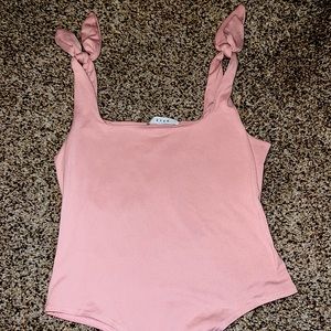 Boutique bodysuit. Ties on shoulder. Size medium